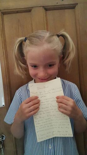 Whizz Pop Bang reader with the handwritten reply from her local MP