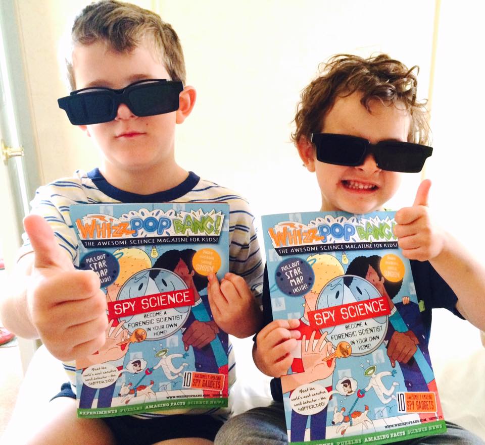 Boys with their SPY issue of Whizz Pop Bang science magazine for kids