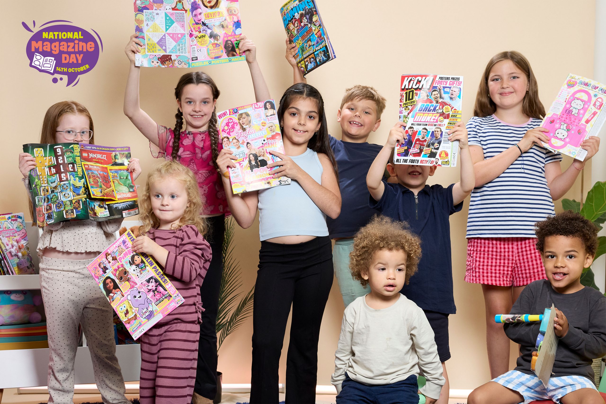 Children celebrating National Magazine Day. Whizz Pop Bang science magazine for children aged 6 to 12
